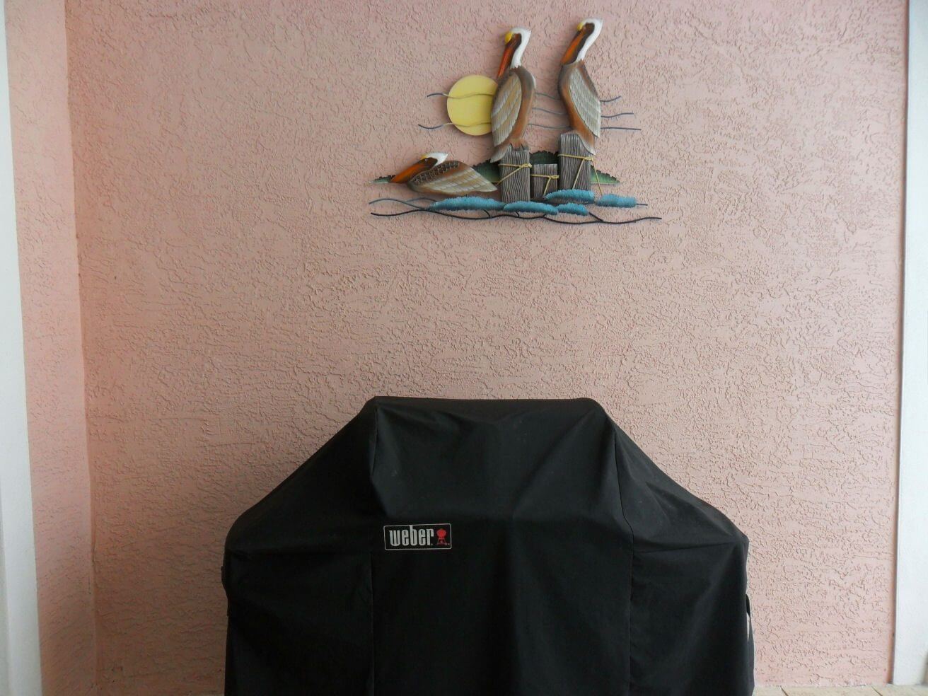 A black grill cover sitting on top of a table.