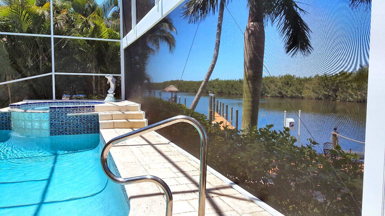 A pool with stairs and steps leading to the water.