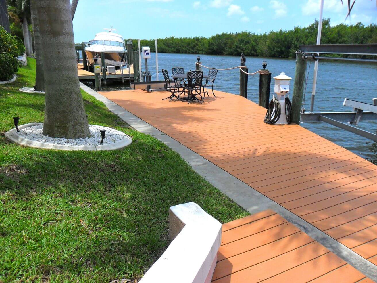 A dock with chairs and tables on it