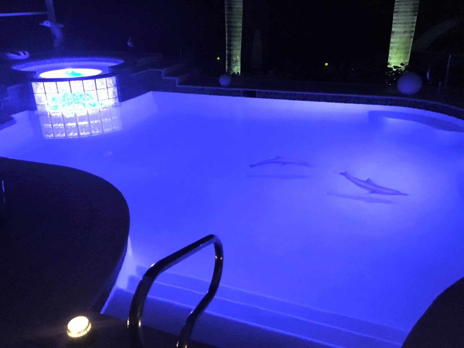 A pool with lights and a light on it