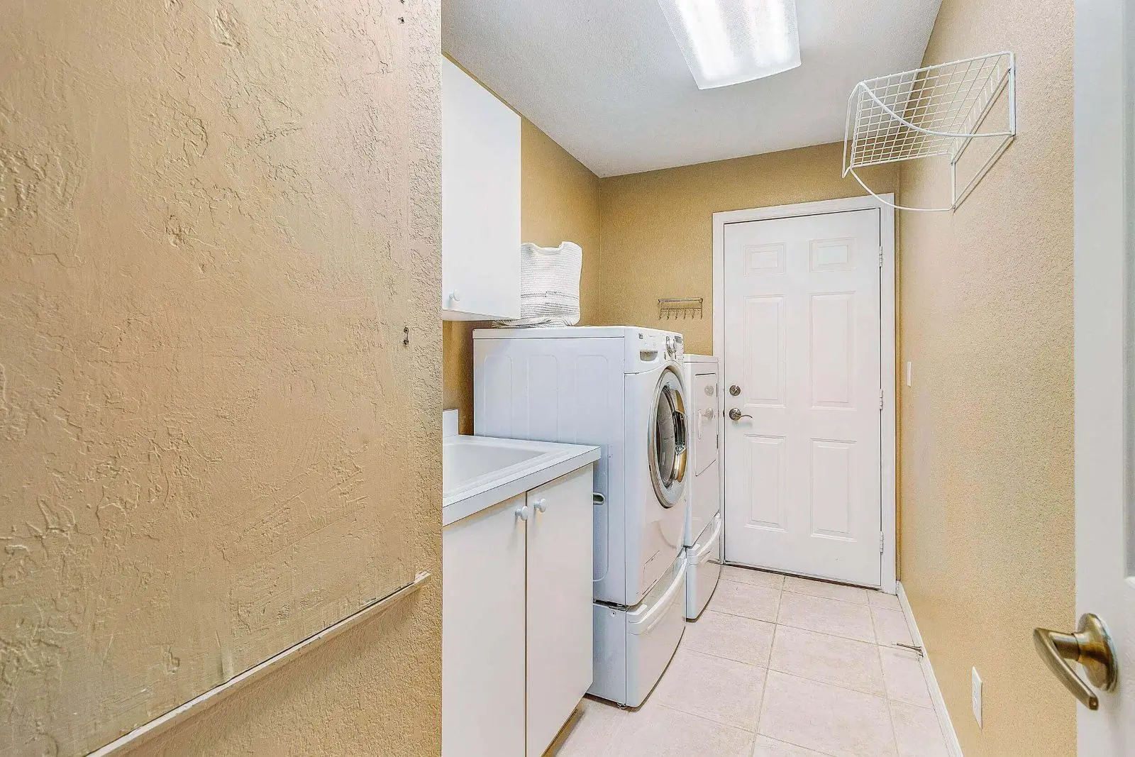 A laundry room with a washer and dryer.